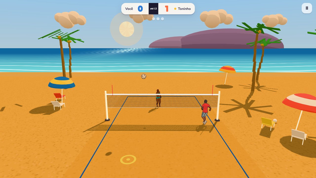 Ponto marcado no futevôlei de praia, com a bola caindo na areia